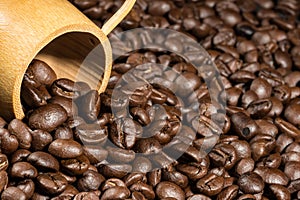 Coffee beans texture background with bamboo cup