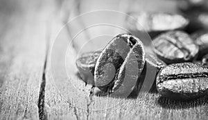 Coffee Beans texture on black and white on the wood background