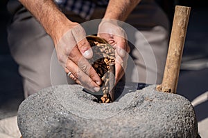 Coffee beans in a traditional stone mill