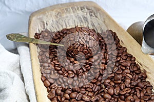 Coffee Beans in an very old wooden tray