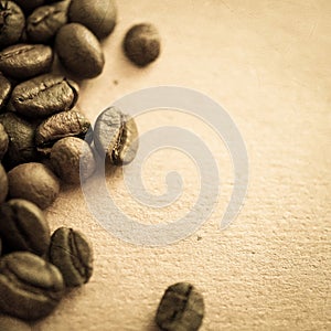 Coffee beans on vintage color paper background