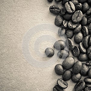 Coffee beans on vintage color paper background