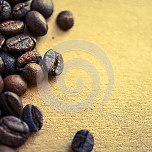 Coffee beans on vintage color paper background