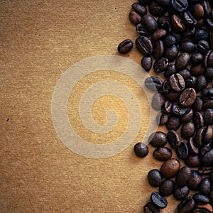 Coffee beans on vintage color paper background
