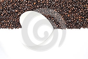Coffee beans on white background with white saucer