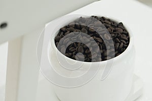 Coffee beans on the white bowl