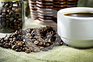 Coffee beans and white cup