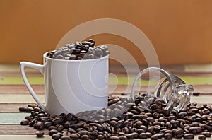 Coffee beans in white cup with clear glass