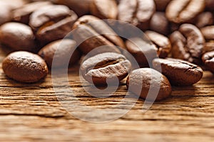 Coffee beans on wood background