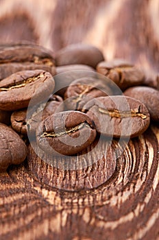 Coffee beans on wood background