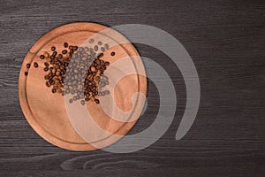 Coffee beans on wooden backgroun. copy space