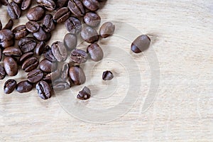 Coffee beans on wooden background, oak wood soft light and beans. Coffee background with wooden texture