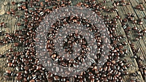 Coffee beans. On a wooden background rotation