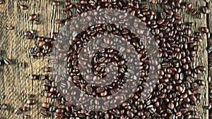 Coffee beans. On a wooden background rotation