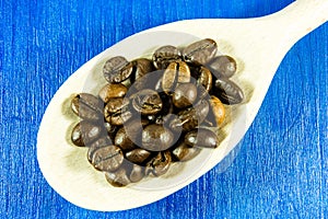 Coffee beans on wooden background photo