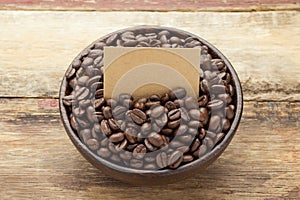 Coffee beans on wooden bowl