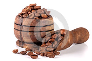 Coffee beans in a wooden bowl with scoop isolated on white background