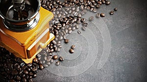 Coffee beans and wooden coffee grinder.