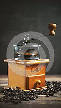 Coffee beans and wooden coffee grinder.