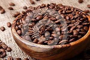 Coffee beans in a wooden dish