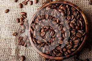 Coffee beans in a wooden dish