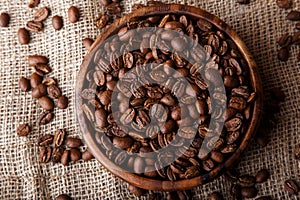 Coffee beans in a wooden dish