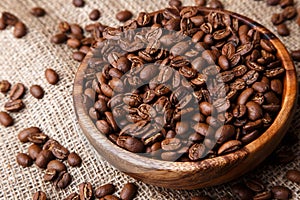 Coffee beans in a wooden dish