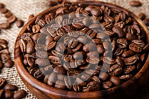 Coffee beans in a wooden dish