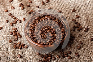 Coffee beans in a wooden dish