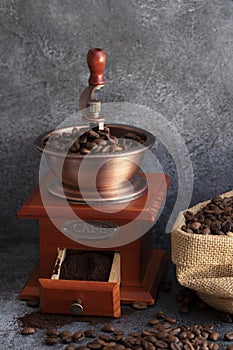 Coffee beans and a wooden grinder
