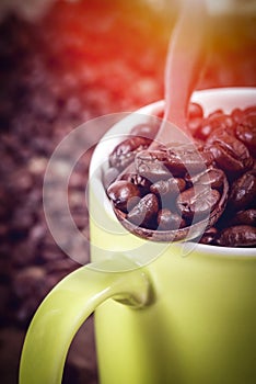 Coffee beans in wooden spoon