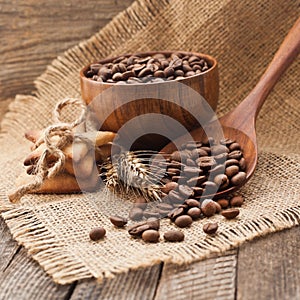 Coffee beans in wooden utensils and biscuits