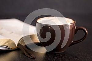 Coffee and a Bible on a Slate Tabletop