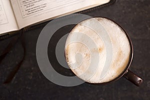 Coffee and a Bible on a Slate Tabletop