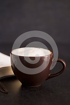 Coffee and a Bible on a Slate Tabletop