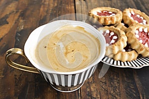 Coffee with Biscuits on a Rustic Wooden Background