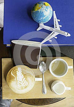 Coffee book airplane and world