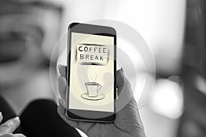 Coffee break concept on a smartphone