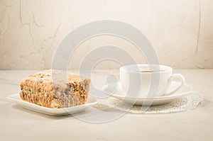 coffee break with a dessert/coffee cup and dessert on a white background. Selective focus