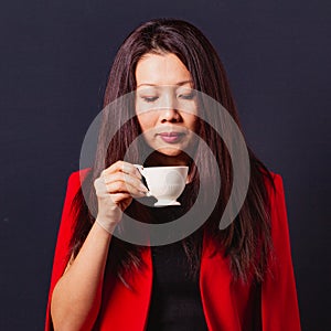 Coffee break. Portrait of elegant asian business woman