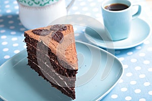 Coffee break: slice of chocolate cake and a cup of coffee