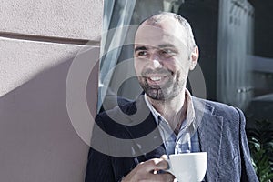 Coffee Break. Sucessful businessman enjoying in a cup of coffee