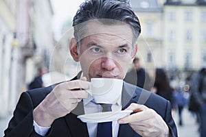 Coffee Break. Sucessful businessman enjoying in a cup of coffee