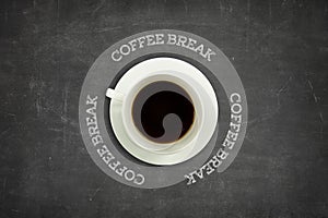 Coffee break text on blackboard with coffee cup