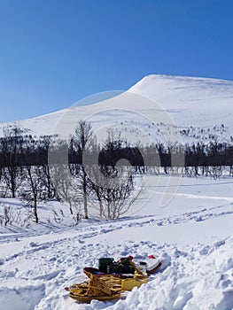 Coffee break in the wilderness among snowy mountains