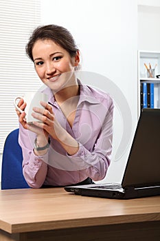 Coffee break for young Asian business woman