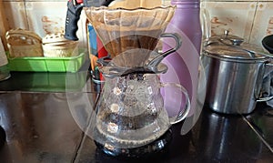 brewing coffee proces using coffee drip glass and jar with V60 paper filter