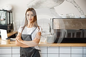 Coffee Business owner Concept - Portrait of happy attractive young beautiful caucasian barista in apron with confident