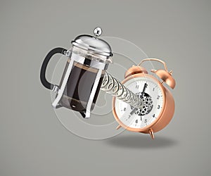 Coffee cafetiere coming out of alarm clock photo