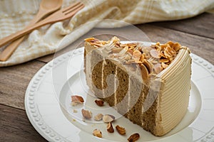 Coffee cake with almonds on plate